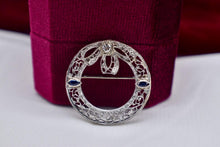 Load image into Gallery viewer, Vintage Art Deco 14K White Gold Wreath Style Bow Diamond & Sapphire Brooch