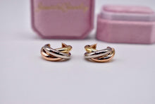 Load image into Gallery viewer, Vintage Pre Loved Cartier 18k Yellow Rose and White Gold Classic Interlocking Trinity Hoop Earrings