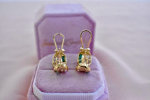 Load image into Gallery viewer, Vintage 14K Yellow Gold Channel Set Emerald &amp; Diamond Criss Cross Omega Earrings

