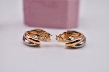 Load image into Gallery viewer, Vintage Pre Loved Cartier 18k Yellow Rose and White Gold Classic Interlocking Trinity Hoop Earrings
