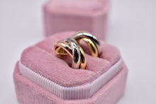 Load image into Gallery viewer, Vintage Pre Loved Cartier 18k Yellow Rose and White Gold Classic Interlocking Trinity Hoop Earrings
