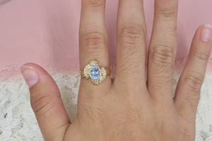 Vintage 14K Yellow Gold Unique Oval Blue Topaz and Diamond Ring